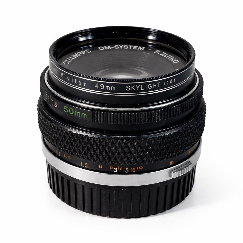 Olympus 50mm Prime Camera Lens in Black and Silver with filter & OM-M43 adapter